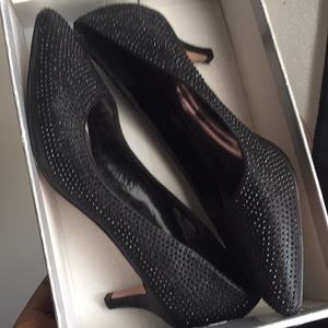 Black pointed toe pumps